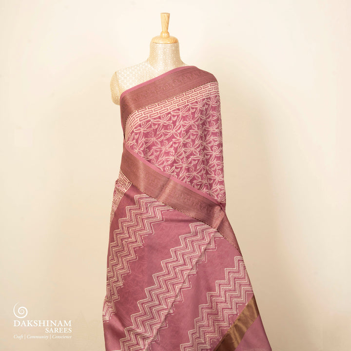 Pink Chanderi silk cotton saree with white floral print, gold zari border and striped pallu