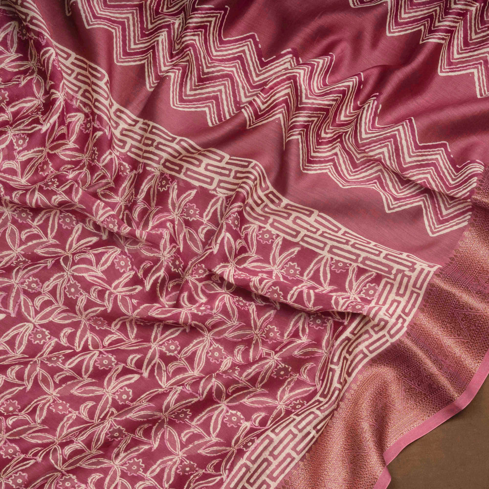 Pink Chanderi silk cotton saree with white floral print, gold zari border and striped pallu