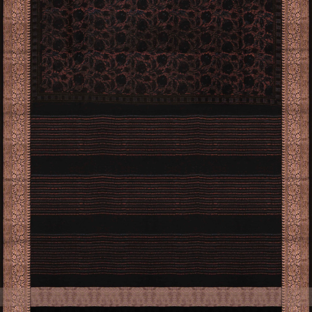 Black Chanderi silk cotton saree with white floral print, brown zari border and striped pallu