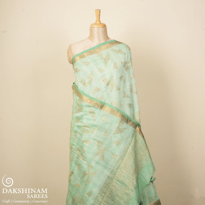 Green Chanderi silk cotton saree with gold zari geometric patterns and embroidered lace border