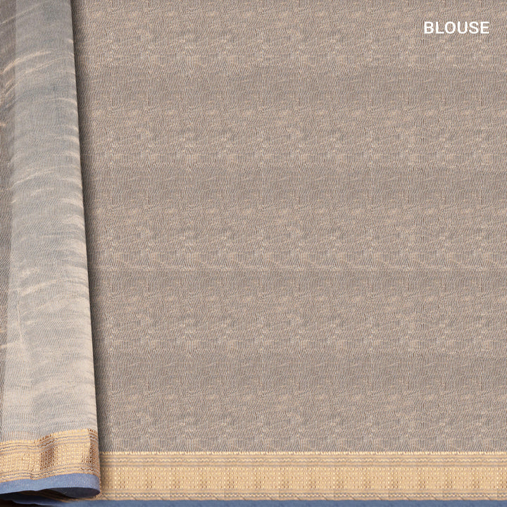 Ice blue Chanderi silk cotton saree with gold zari geometric patterns and embroidered lace border
