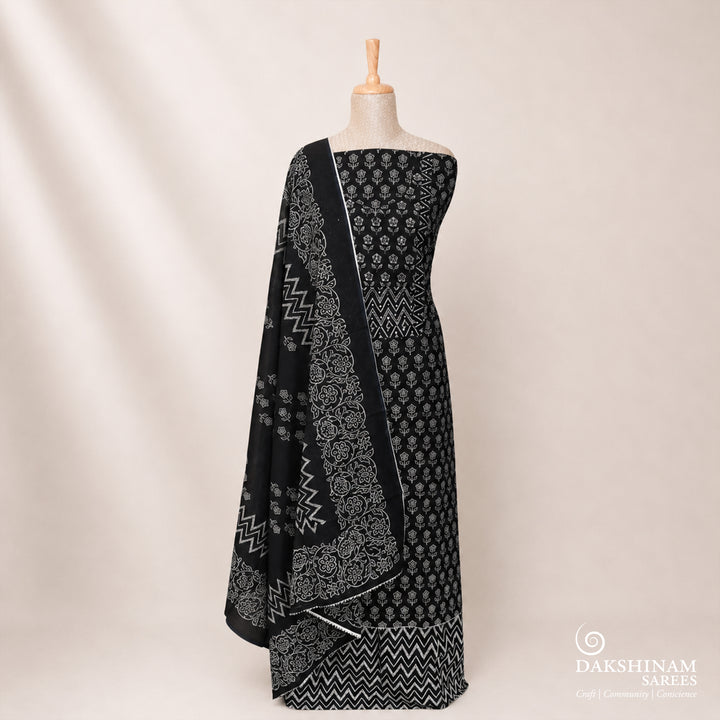 Black three-piece suit set with floral buttas, sequin neckline and chevron detailing