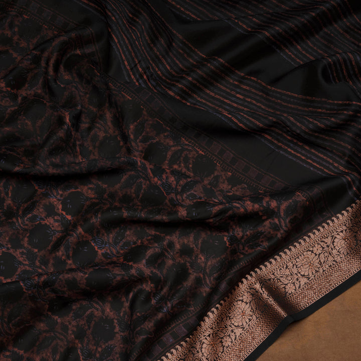 Black Chanderi silk cotton saree with white floral print, brown zari border and striped pallu