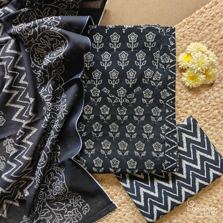 Black three-piece suit set with floral buttas, sequin neckline and chevron detailing