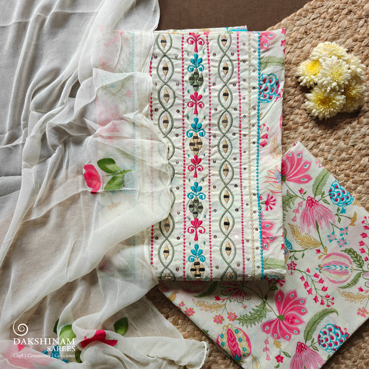 White three-piece suit set with floral embroidery, mirror work and hand-painted dupatta