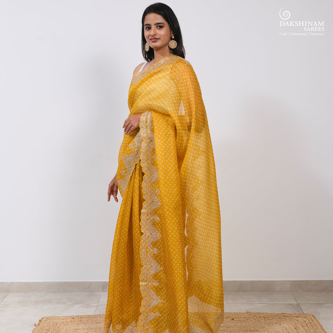 Pleats/body of Handwoven Yellow Bandhini with embroidered organza silk Saree