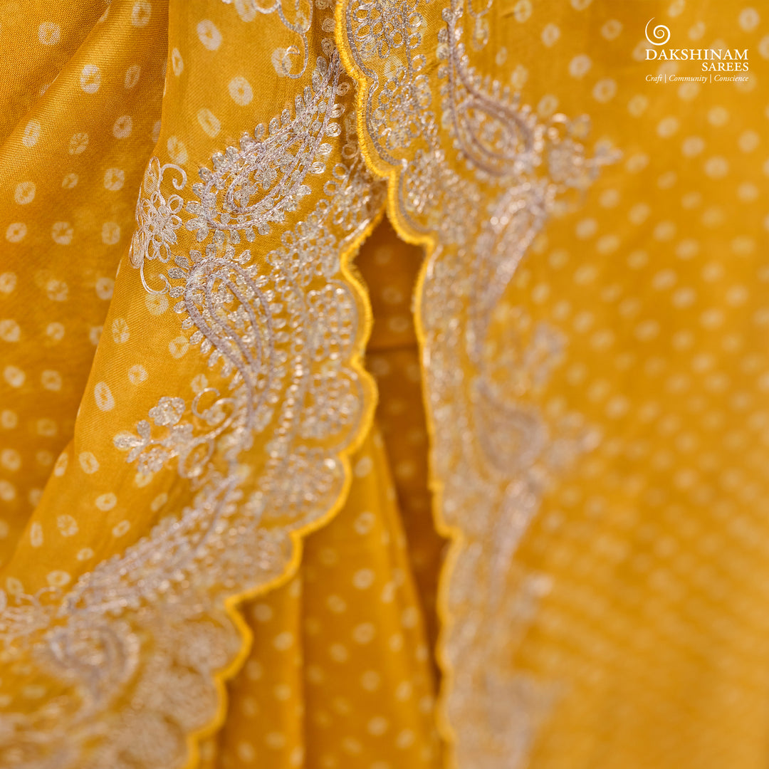 Closeup of Handwoven Yellow Bandhini with embroidered organza silk Saree