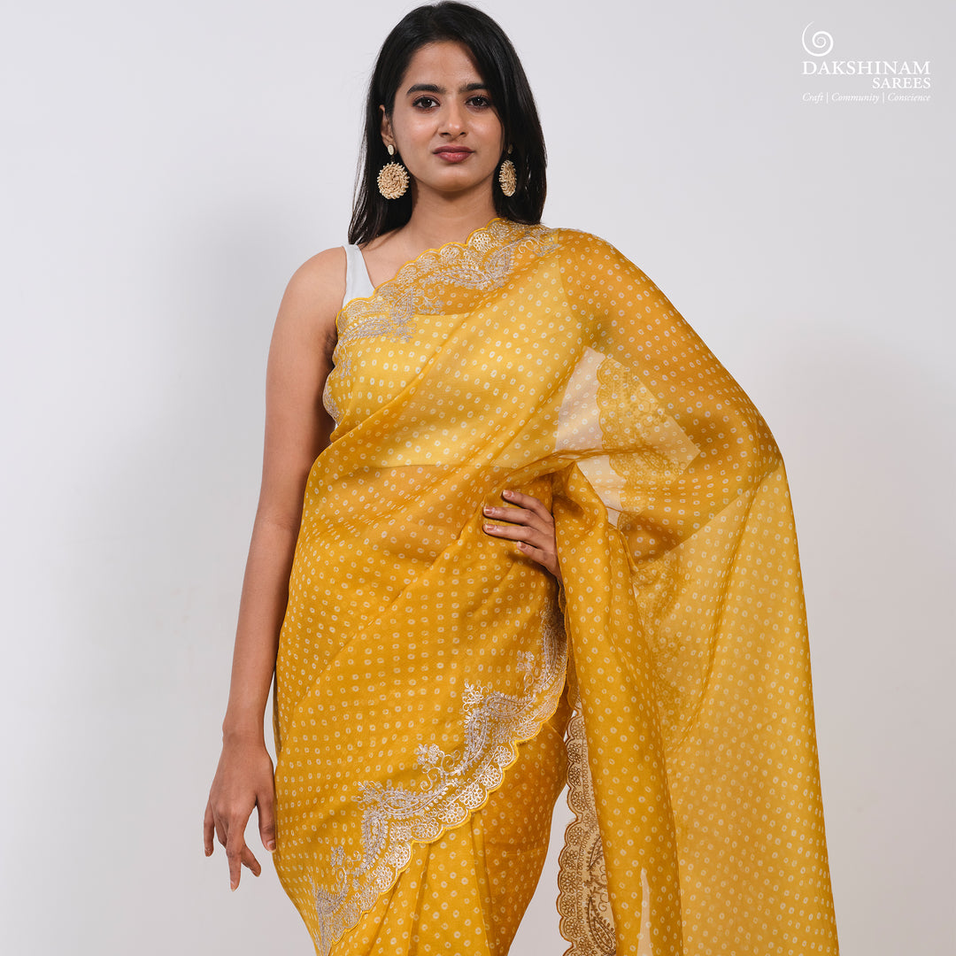 Pleats/body of Handwoven Yellow Bandhini with embroidered organza silk Saree